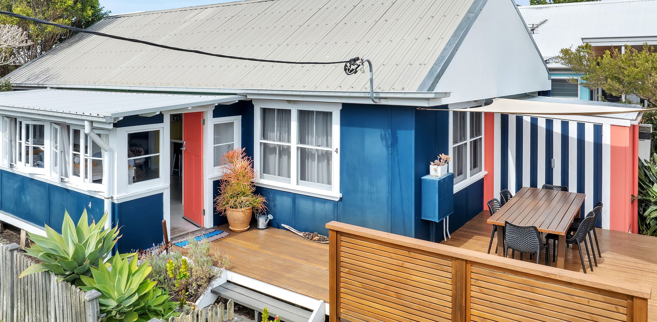Outdoor living on the large deck with hidden BBQ, views of the beach and beyond.