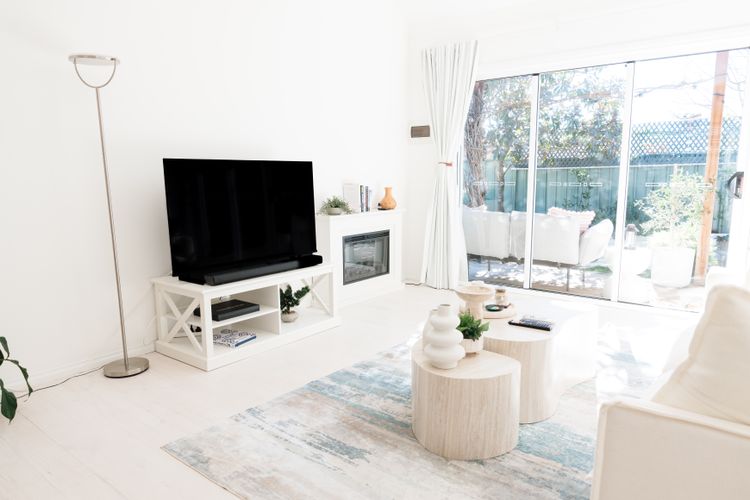 Big smart TV with great soundbar and a fireplace for ambience.