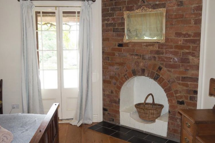 Bedroom 1 with lovely french doors to the verandah