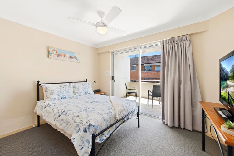 Bedroom 2: Doube bed, balcony access, and a built-in robe