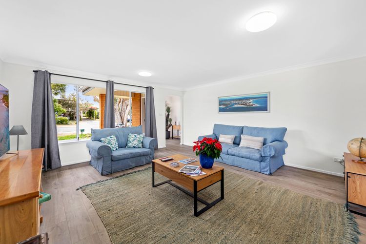 A comfortable and spacious living room with Wi-Fi, smart TV, DVD player, books, and even board games for your entertainment.