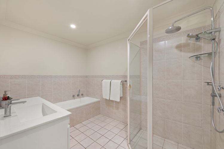 Bathroom 1 with separate bath, shower and vanity