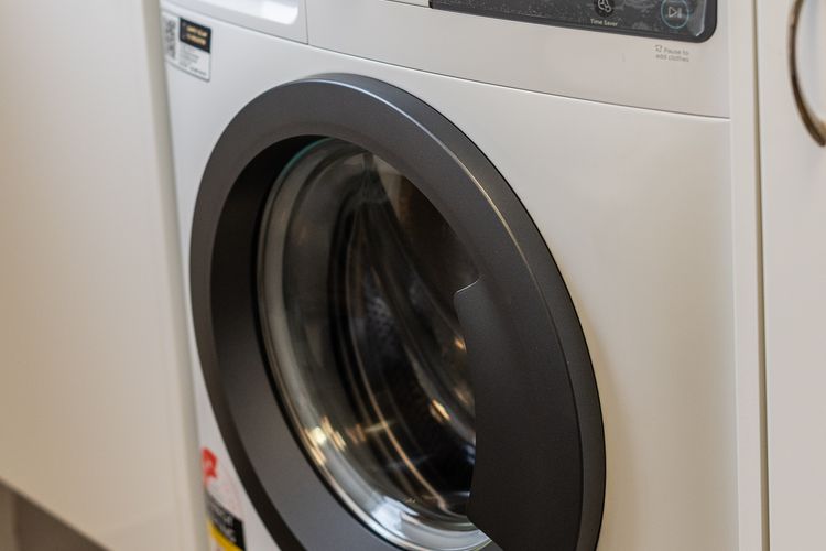 Washing machine in combined bathroom/laundry