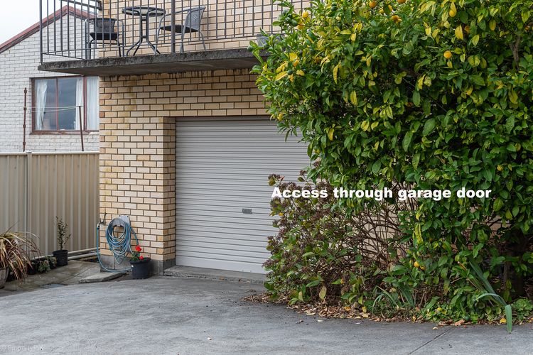 Access is through the garage door (no parking in garage)