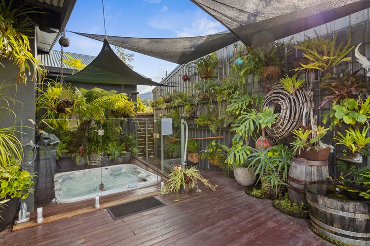 Spa seats 5 people and is wonderfully private, surrounded by plants and gorgeous views to the bay, garden and MONA!