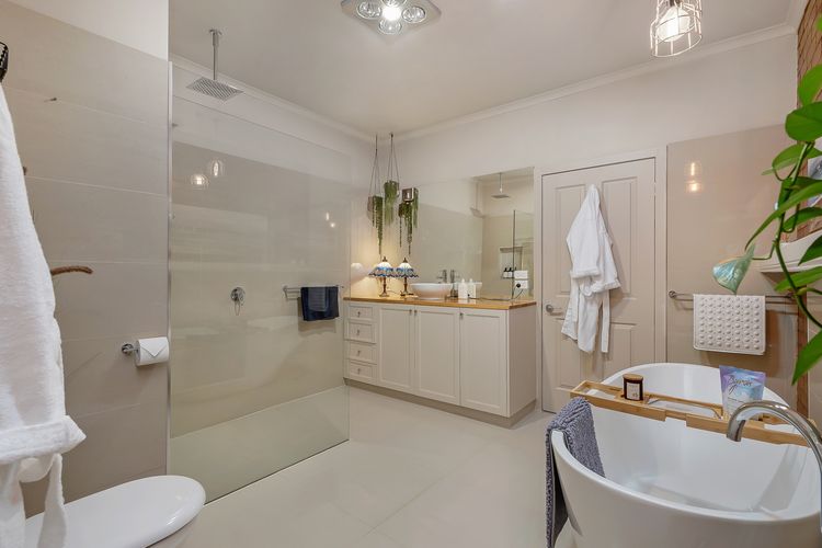 Main bathroom with shower and deep bath tub.