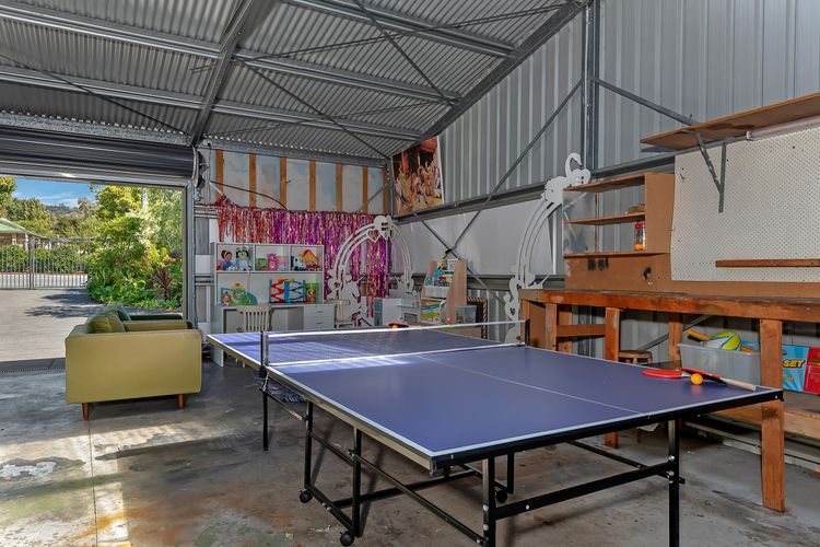 Spacious double garage with table tennis and plenty of kids toys for all ages.. Parking for one car in garage or can park 2 cars in driveway.