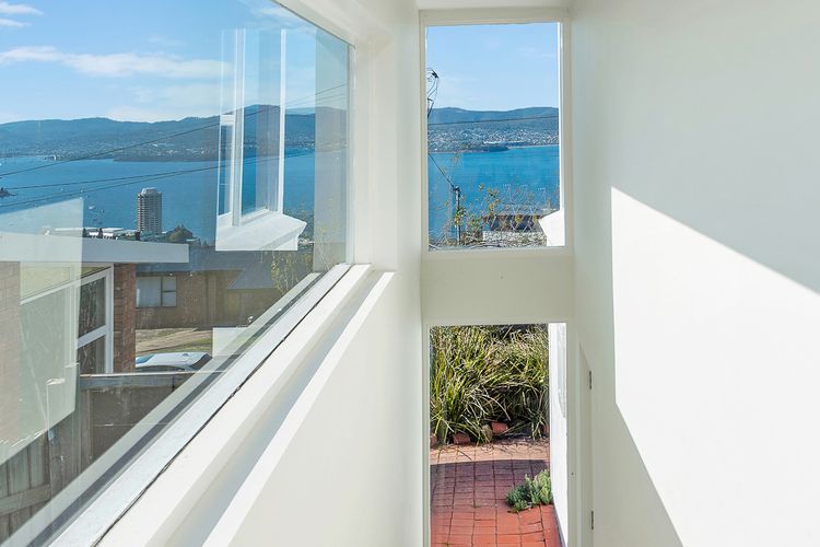 Stairs leading from King bedroom to lower level bedroom/ensuite