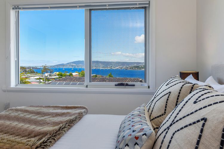 Deep Blue Wow views over river city mountain