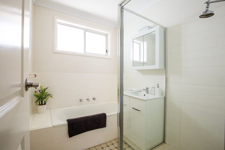 Bathroom with shower and small bath