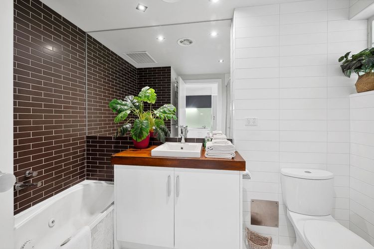 Private bathroom with bath