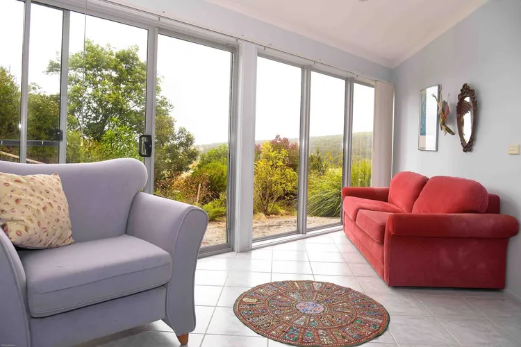 Downstairs sitting room with access to backyard.