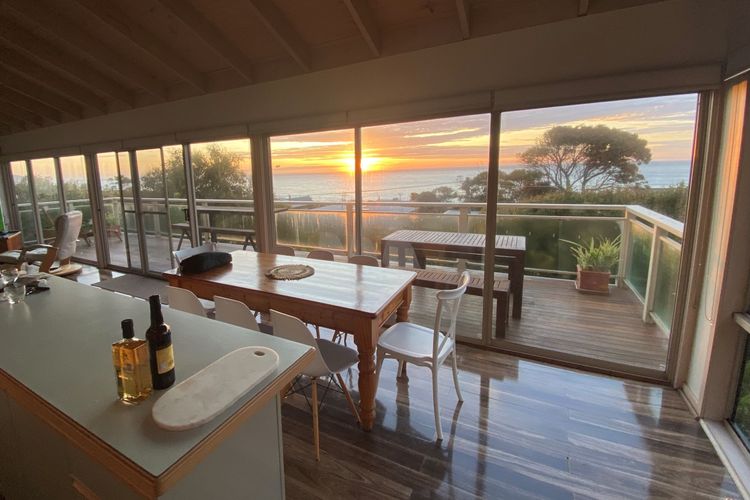 Dining area with access to balcony with outdoor furniture