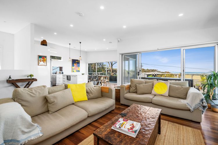 Upstairs is the main living space which opens out to the balcony.