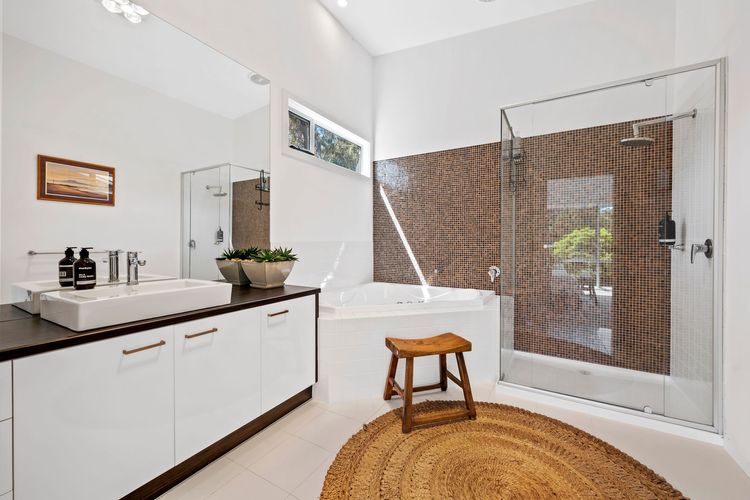 A luxurious spa bath, shower and toilet