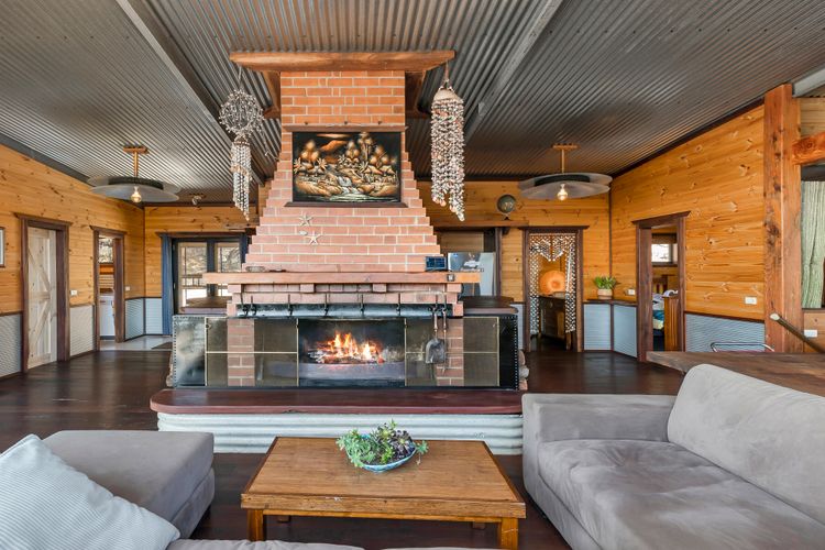 Central brick open fireplace adds charm