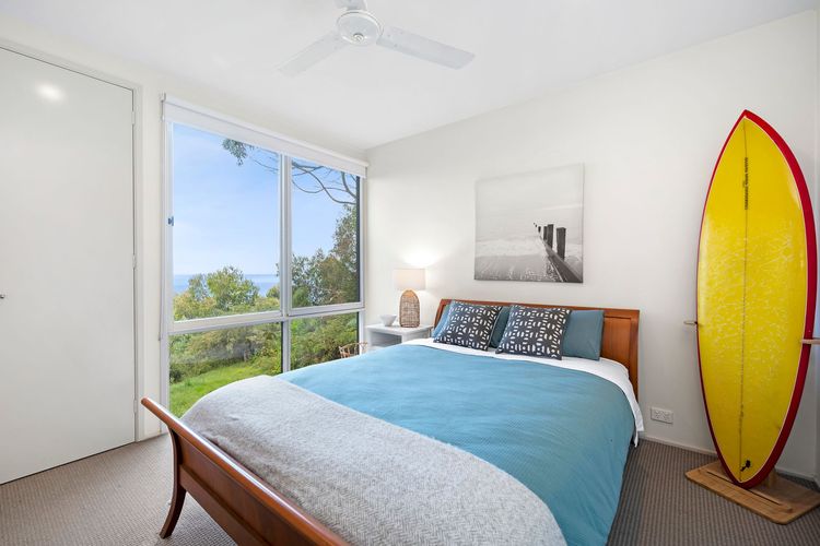Queen bed with built-in robe and ceiling fans