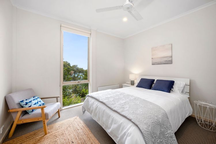 Queen bed with built-in robe and ceiling fans