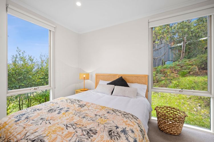 Queen bed with built-in robe and ceiling fans