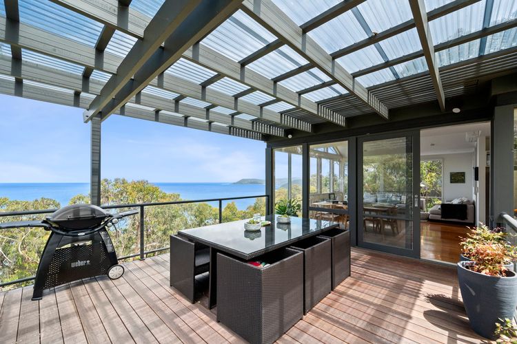 Walk up to the upper living room and deck, and see the magic happen. From there, you can take in the unparalleled beach view, a breathtaking scene as you enjoy chilly mornings or watch the sunset in the late afternoon.