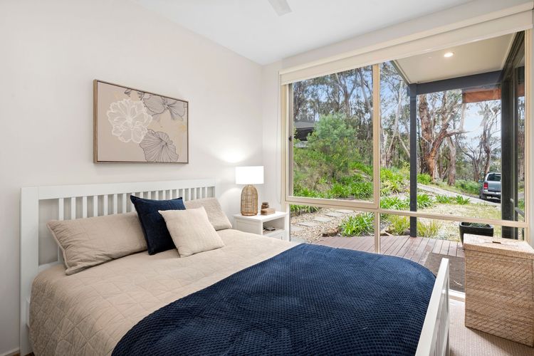 Queen bed with built-in robe and ceiling fans