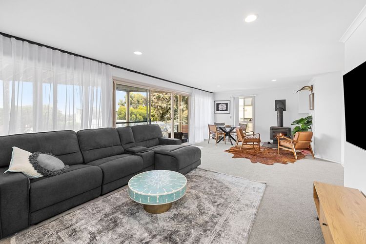 Another lounge area with large couches to accommodate the rest of the guests comfortably. It has a Wi-Fi, flat screen TV, multiple TV's, an Apple TV and even some books and board games for recreation.