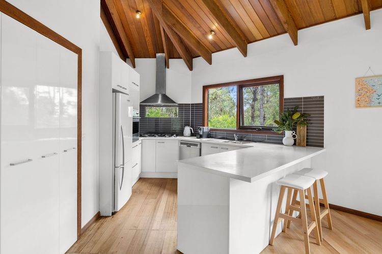 The kitchen is equipped with modern amenities and equipment.