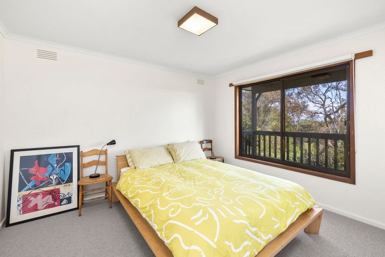 Bedroom with queen bed and built-in robes.