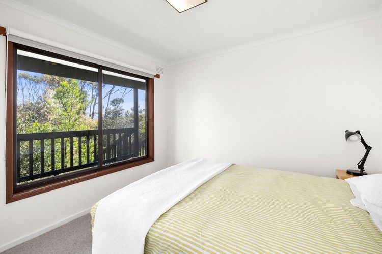 Bedroom with queen bed and built-in robes.