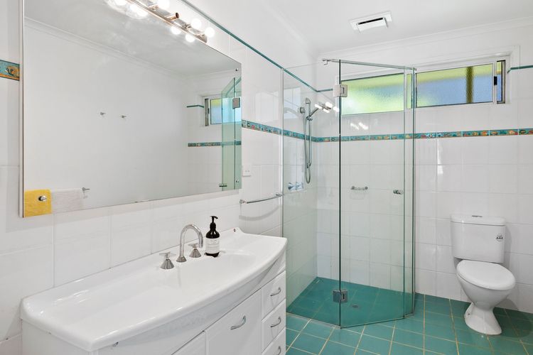 The main bathroom has a shower and a toilet.