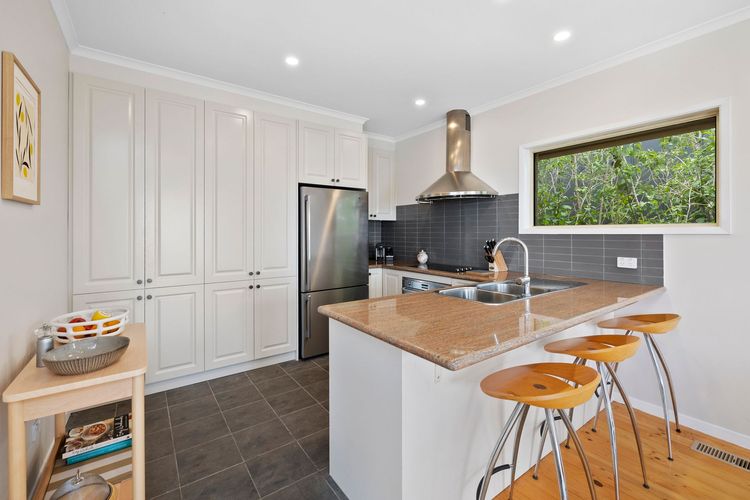 Preparing meals is made simple and easy with the kitchen's full amenities and modern equipment and appliances.