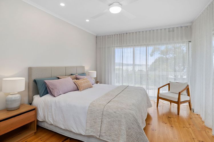 Bedroom 1: King bed, balcony access, built-in robe, and an ensuite with shower and toilet
