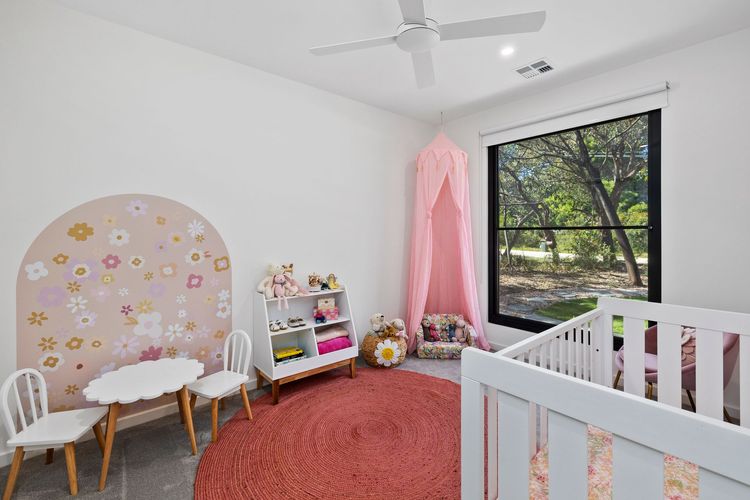 Bedroom 4: A lovely baby room with a cot 