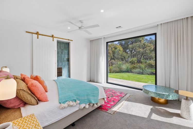Master bedroom: King bed and an ensuite with a shower, toilet, and bathtub.