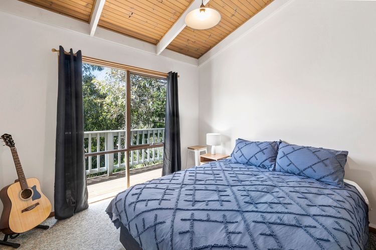 Bedroom 1 has a Queen bed, built-in robe, and amazing views by the window.