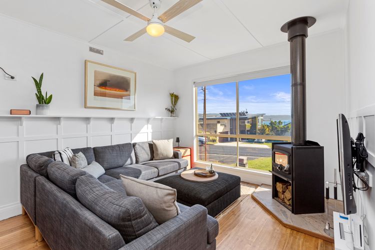 The living room looks inviting with its comfy couches, flat-screen TV, and Wi-Fi.