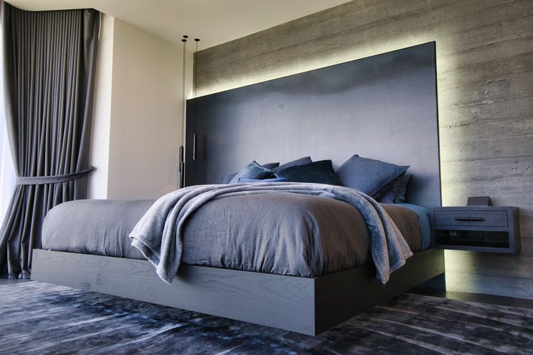 Professionally designed Bed with wall-mounted furniture