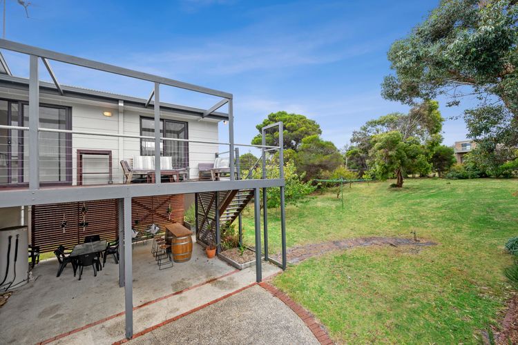 Shaded patio area and sunny deck above