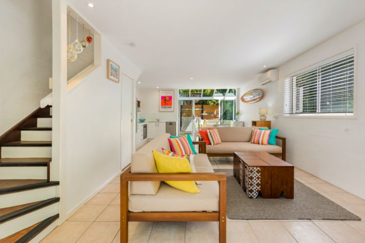 Living area is downstairs, with bedrooms and bathroom upstairs.