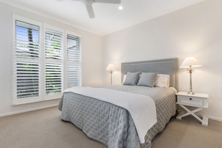 Bedroom 2 - This guest room has a Sleepmaker King bed, a built-in robe, and an ensuite with a shower and toilet.