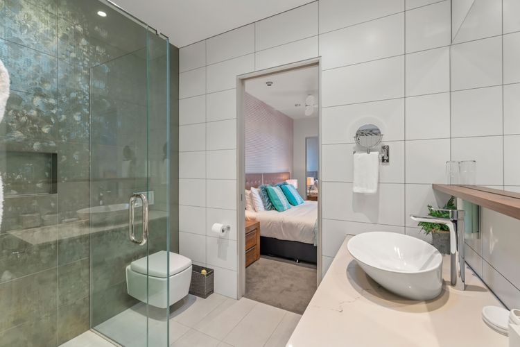 Ensuite bathroom with walk-in wardrobe.