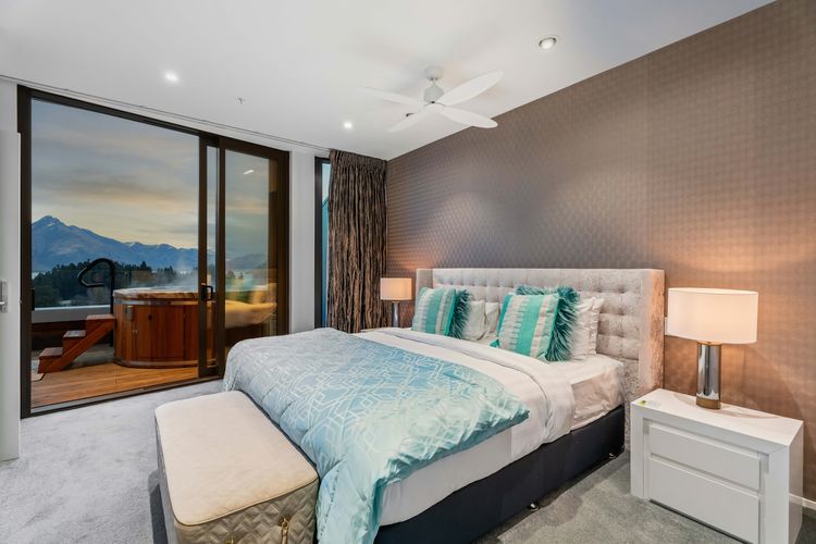 Master bedroom with immediate balcony/hot tub access.