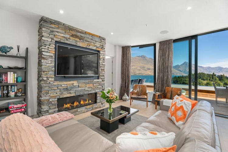 Living room with stunning views and cosy fireplace.