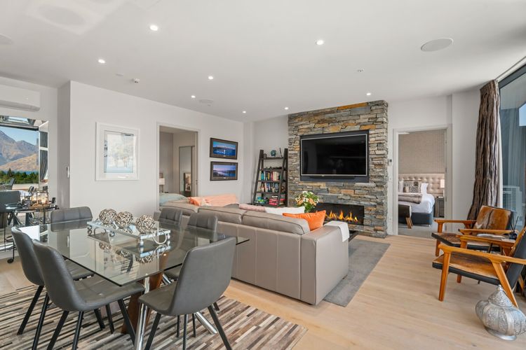Living room with stunning views and cosy fireplace.