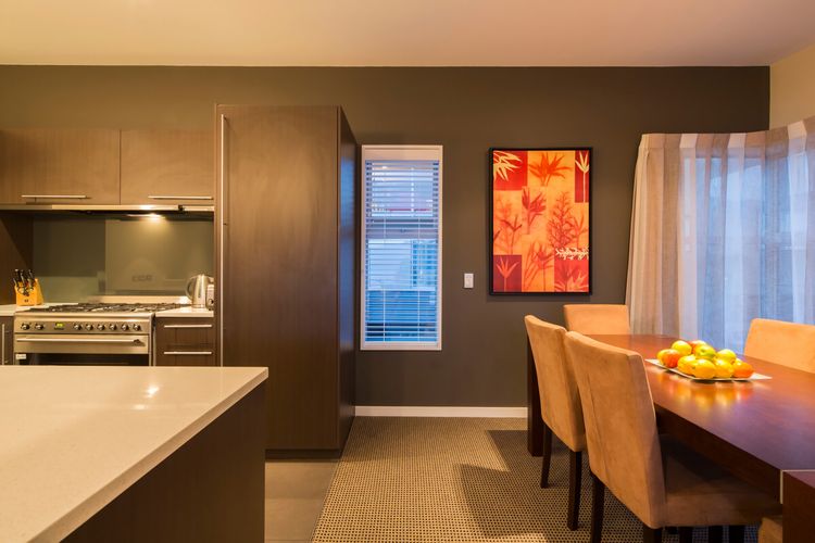 Dining table and kitchen.