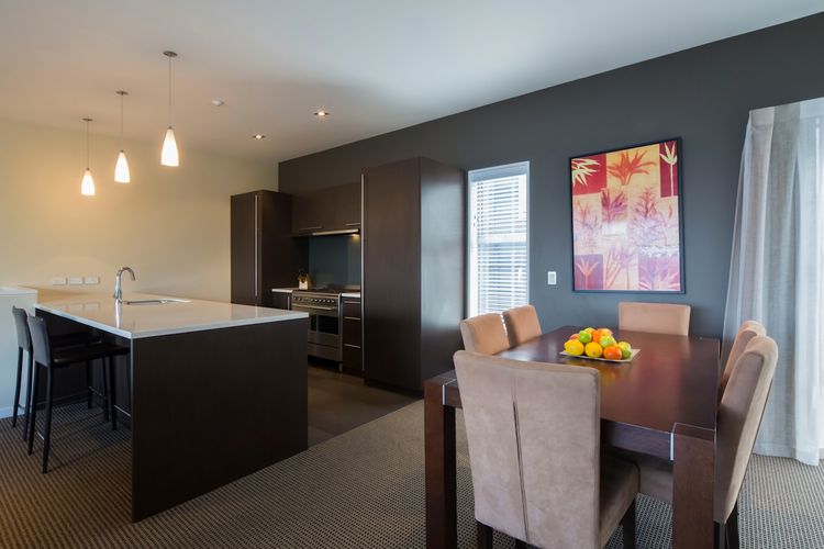 Dining table and kitchen.