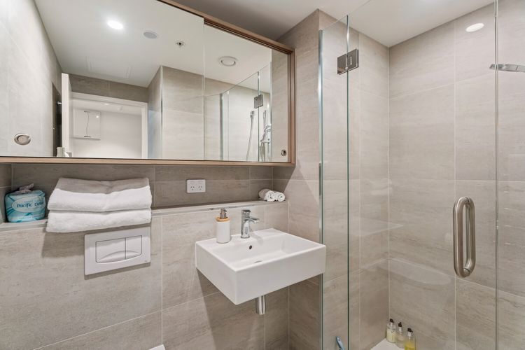 Both bathrooms are clean and modern with full tile floors and walls. Shower products and hairdryer are supplied.