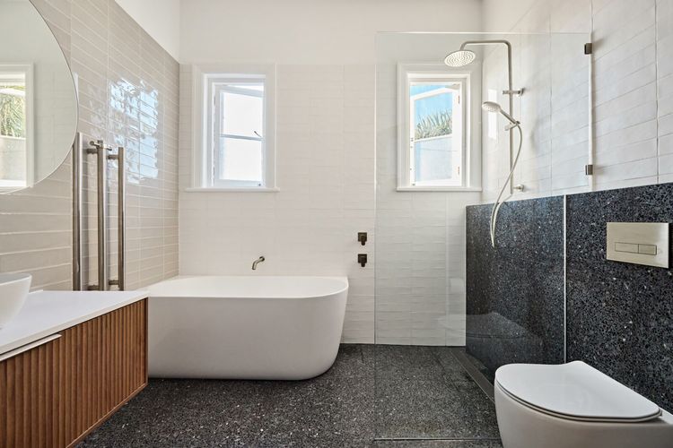Modern bathroom featuring a clean, stylish toilet