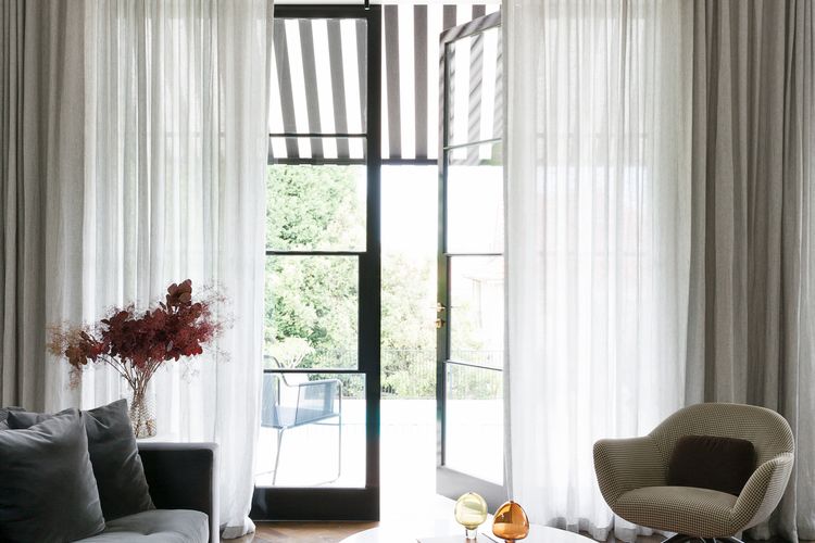 Lavish living room with a dramatic chandelier for grand conversations.