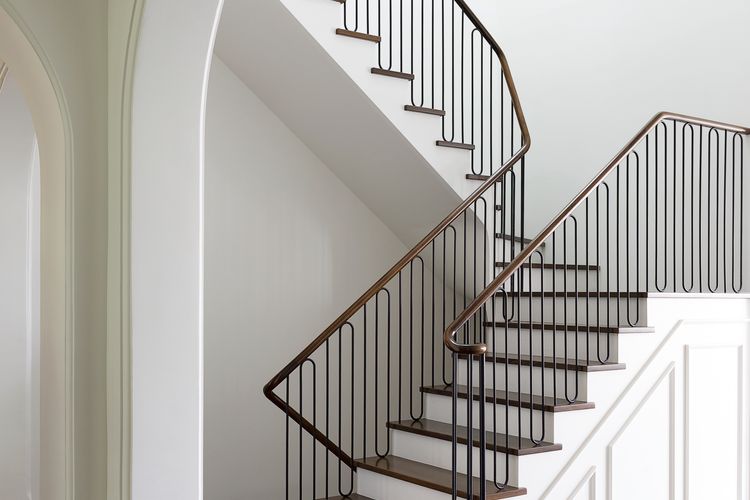 Grand staircase with elegant railings and historic charm.